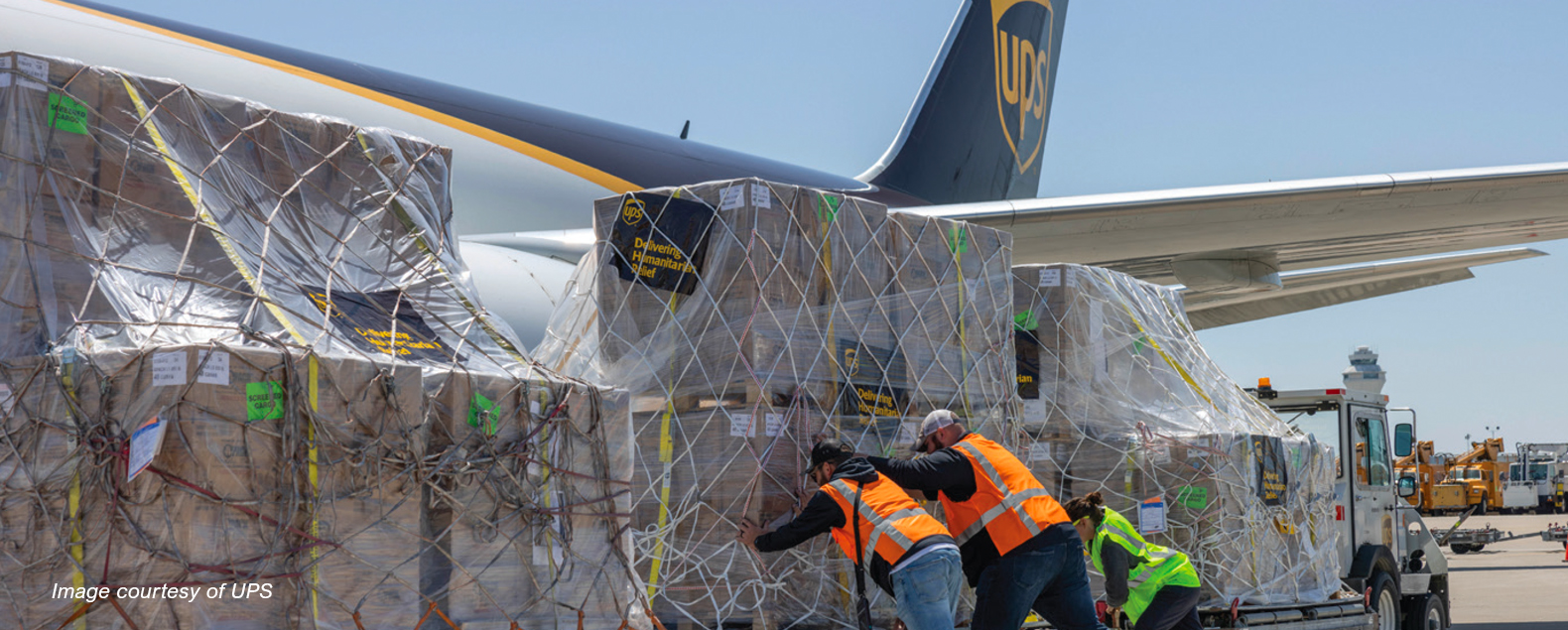 A large cargo plane partnering with the private sector during a health emergency.